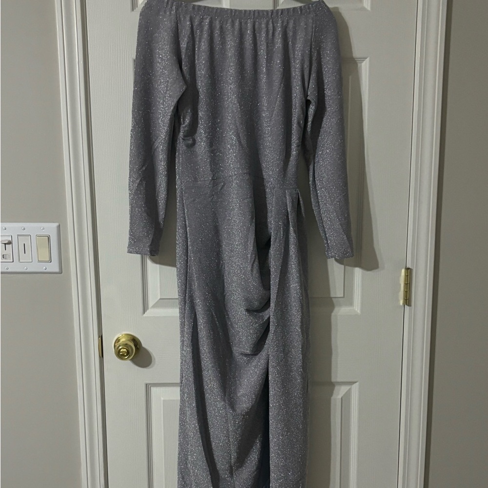 This beautiful silver sequence dress is gorgeous on!   Deep thigh slit.